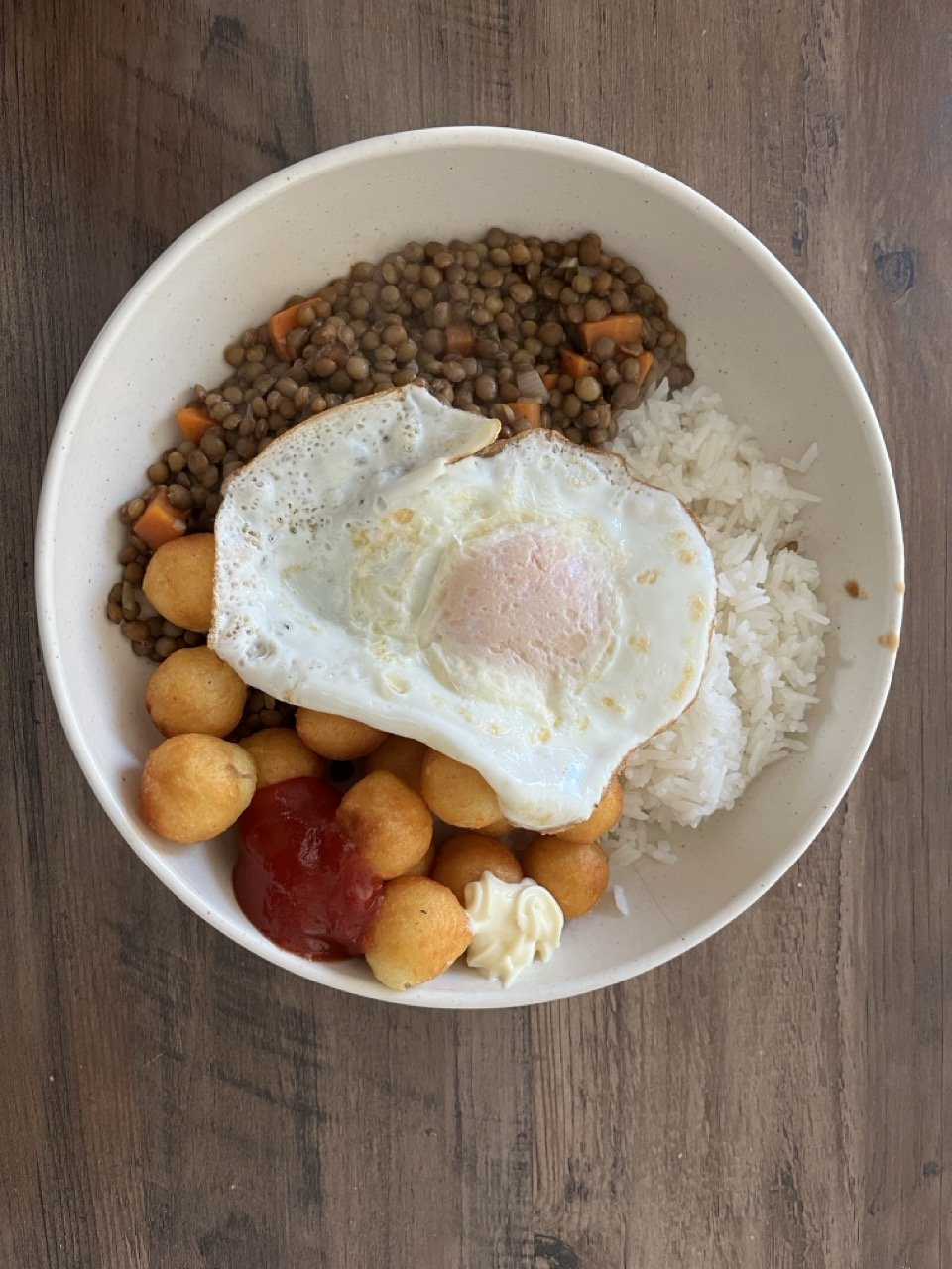 lentils with rice and an egg on top