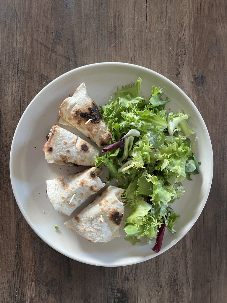 Hummus burrito and salad